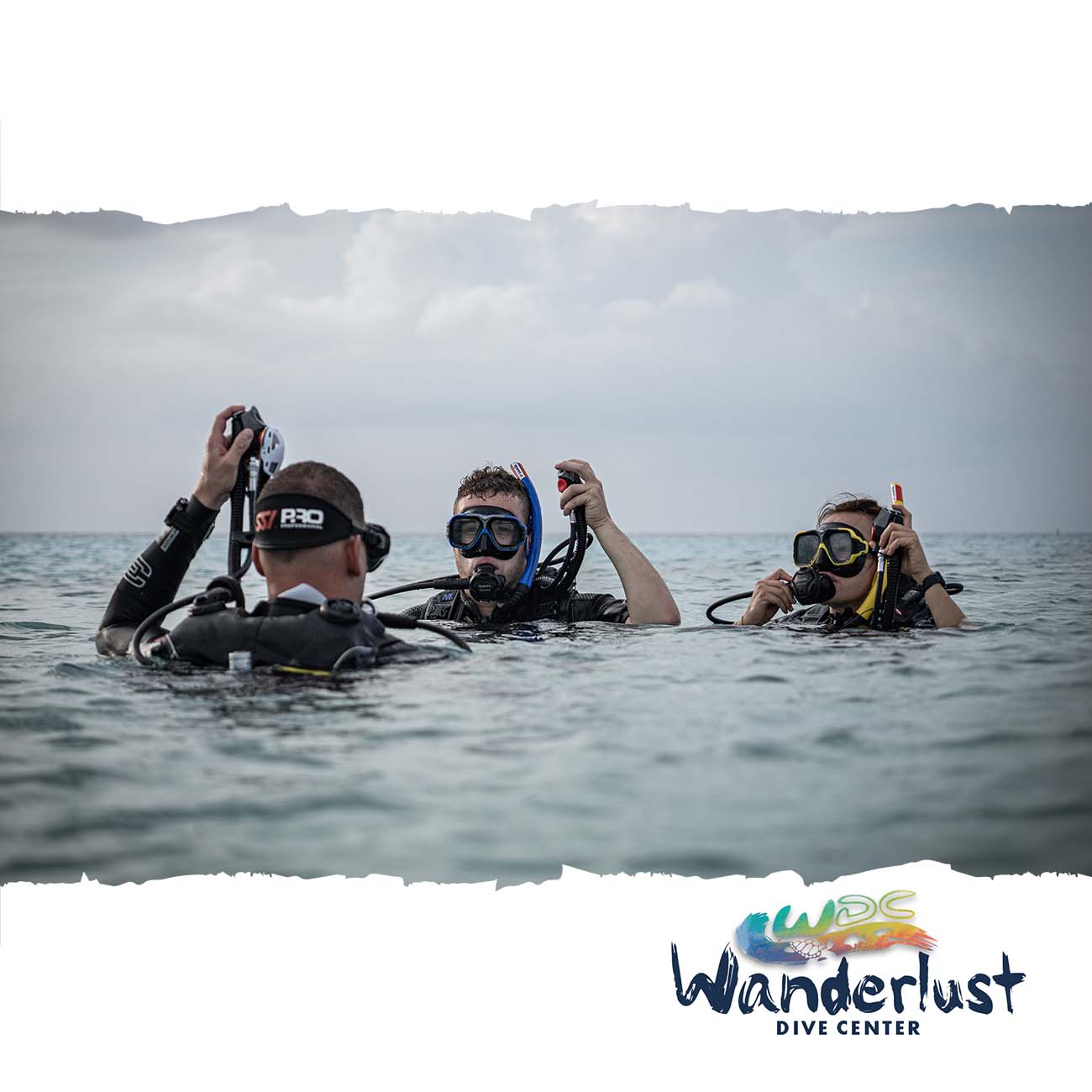 Two divers smiling at the surface during a relaxed training session on Bonaire